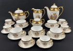 Mauá. Serviço para chá e café em porcelana esmaltada na cor branca, decoração policroma com medalhão de cena galante ao centro e ricos detalhes em ouro. Composto de bule de chá, bule de café, leiteira, açucareiro, 5 xícaras para chá com 6 pires e 6 xícaras para café com 6 pires. Medindo respectivamente; 16,5 x 23 cm, 22 x 21 cm, 15 x 14 cm e 11 x 13,5 cm. Xícaras e pires apresentam desgastes. Uma xícara de chá com restauro na alça, pires de chá com bicado.