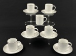 Roberto Simões. Seis xícaras para café em porcelana esmaltada na cor branca, delicada decoração floral em branco e filetes em prata. Manufatura no verso.