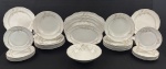 Schmidt. Parte de serviço/aparelho para jantar em porcelana nacional esmaltada na cor branca, delicada decoração floral, detalhes em alto relevo e filetes em ouro. Bordas onduladas. Composto de 12 pratos rasos, 12 pratos fundos, 12 pratos para sobremesa, saladeira e 3 travessas. Manufatura no verso. Medindo respectivamente: 24 cm, 4 x 23 cm, 18 cm, 6 x 24 cm, 29 x 18 cm. 33 x 22 cm e 38 x 24 cm.