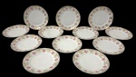MAUÁ. Conjunto de 12 pratos de sobremesa em porcelana nacional. Medidas: 18 cm de diâmetro.  Um com restauro na borda.