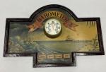 Placa decorativa de parede em madeira, com contorno recortado e moldurado, decoração policromada de paisagem marítima com embarcações e inscrição BAROMETER. Ao centro, termômetro Eska com caixa em metal dourado e escalas Celsius e Fahrenheit. Apresenta riscos, desgaste na pintura e oxidação no metal. Medidas: 41 x 60 x 8 cm.