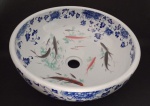 Cuba em porcelana oriental com decoração de  flores e peixes. . Medindo 40 cm de diâmetro x 15 cm de altura.