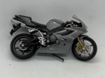 Miniatura Motocicleta Triumph 675 Triple Daytona, com suspensão flexível. Item no estado conforme fotos. Carrinho de Coleção.