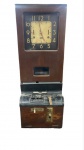 RELÓGIO - Imponente relógio de ponto mecânico e industrial da marca IBM em gabinete vertical de madeira nobre, apresentando mostrador principal analógico de grandes algarismos, visor central de registro e base inferior em ferro com mecanismos originais. Med. 95x36x27 cm. <br><br>Móveis Usados - Lote de móvel antigo e usado, podendo apresentar marcas de uso e desgaste natural do tempo. Há possibilidade de danos ocultos e ou outras imperfeições. Não há garantia ou possibilidade de devolução após a aquisição. Recomenda-se inspeção prévia.