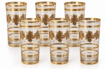 Jogo de seis copos longos em cristal veneziano translúcido, adornados com folhas de parreira e contornos em vibrante ouro. Dois copos apresentam desgaste no dourado. Meados anos 50. Medida: 14,5 cm de altura.