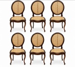 BRASIL SÉC. XIX - Jogo de seis raras cadeiras de jantar, século XIX, estilo medalhão, com estrutura em jacarandá maciço, espaldar oval e assentos em palhinha. Apresentam elegante desenho curvilíneo e proteção em madeira no espaldar, característica do mobiliário de época. Peças de acentuada elegância, representativas do mobiliário oitocentista. Mede 100 x 48 cm.