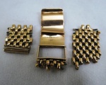 Sucata de ouro 18 k, parte de pulseira de relógio, contrastada. Peso 12,8 G.