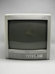 Televisor de tubo (CRT) da marca SEMP, linha Lumina Line, com tecnologia MaxColor indicada no painel frontal. Gabinete em plástico nas cores cinza e bege. Painel frontal com quatro botões de controle e botão liga/desliga. Grade de ventilação lateral visível. Cabo de força presente. Apresenta marcas de uso, sujidade e riscos na carcaça. Tamanho estimado compatível com tela de 14 polegadas. Funcionamento não verificado. Sem controle remoto. Estado de conservação regular. monitor de tubo, aparelho de TV, televisão de tubo, receptor de vídeo, TV analógica
