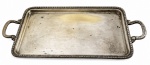 PRATA WOLF - Bandeja retangular em metal prateado, com borda decorada em relevo e alças laterais ornamentadas. Apresenta pátina e sinais de uso originais. Mede 44 x 21 cm.