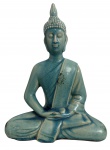Buda em cerâmica esmaltada, sentado em posição de meditação, com acabamento craquelado em tons de verde e azul-petróleo. Peça decorativa de inspiração oriental. Desgaste do tempo. Medidas: 24 x 18 cm.
