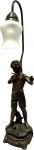 Escultura/Luminária em petit bronze patinado representando Jovem Flautista, funcionando. Med. total 70 cm.