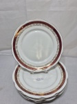 RENNER - Jogo de 6 pratos rasos de mesa em porcelana, vinho com ouro. Medindo 24cm de diâmetro. Friso com desgaste.