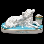 Grupo escultórico em porcelana alemã representando cachorros brincando titulado `IMPUDENCE` e assinada ` D.C.FRENCH`. Meds: 13,0 cm x 24,7 cm