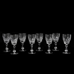 Conjunto de 8 copos em fino cristal europeu lapidado em facetados. Altura: 16,7 cm