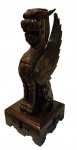 Escultura de madeira nobre representando figura mitológica oriental  medindo 80 cm alt x 32,5 x 32, 5 cm.