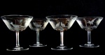 4 cálices de cristal da Bohemia, ricamente lapidados, cada cálice tem uma lapidação diferente, com representação de águia, raposa, cervo e perdiz ,1 cálice com bicado,  12cm por 12cm de boca