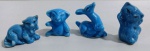 Jogo de miniaturas em porcelana . 4 peças representando vários bichinhos azuis. Bem conservados. Medem: 3 a 4 cm