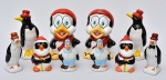 COLECIONISMO - Coleção constando 10 estatuetas em porcelana ditas "pinguins de geladeira", confeccionadas em cerâmica vitrificada, todas policromadas. Med.: de 13 cm a 21 cm. Obs.: 1 delas apresenta lascados no bico, outra com pequenas perdas de pigmentos.