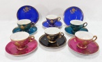 PORCELANA WINDSOR - Conjunto com 6 xícaras para café e 8 pires em porcelana colorida com flores em realces dourados. (um pires com restauro) .