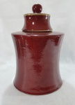 Grande potiche oriental em cerâmica esmaltada "Sangue de Boi" com tampa. Med. 34 x 22 cm.