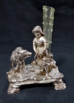 WMF - Floreira em metal espessurado à prata, cinzelado na forma de menina com lobo com vaso solifleur em vidro soprado. Altura 12 cm.