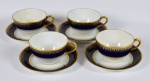 Belo conjunto de quatro xícaras com pires para chá em porcelana francesa Limoges com linda decoração na cor azul cobalto e ouro - med. 6,0 cm x 9,0 cm de diâmetro (xícara) e med. 14,0 cm de diâmetro (pires)