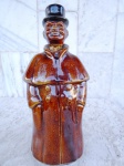 A. LOPES - LOZUR : Garrafa decorativa em faiança esmaltada no tom castor e vitrificada representando FRADE . Rolha com escultura de rosto de frade. Altura 26 cm ( não contem conteúdo )