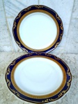 Par de pratos em porcelana branca com faixa em Ouro e bordas em cobalto com ornamentação em alto relevo de ramagens em ouro. Marcado COBALTO - Gravação Legítima - porcelana SCHMID - Sta Catarina - Btazil . medindo 24, 5 cm