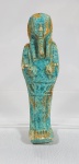Ushabti em faiança ao estilo do período ptolomáico. Med. 10 cm
