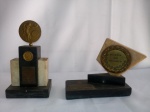 Lote composto de 2 troféus C.A.Goyana datados de 1960 e 1962; pedra e bronze; peça maior aprox. 18x9x5cm