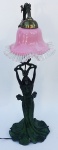Abajur antigo com pé representando figura feminina. Cúpula de opalina rosa. 54 cm de altura