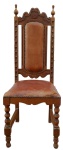 Cadeira de madeira nobre entalhada, com assento e espaldar acolchoado. 44 x 44 x 100 cm de altura. Necessita troca de estofado.