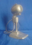 Microfone da epoca com base, medindo: alt. 23cm  comp. 10cm   larg.12cm.