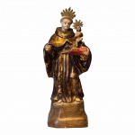 Santo Antônio com Menino. Imagem luso-brasileira esculpida em madeira policromada e dourada, resplendores em metal. Sec. XIX. 47 cm.